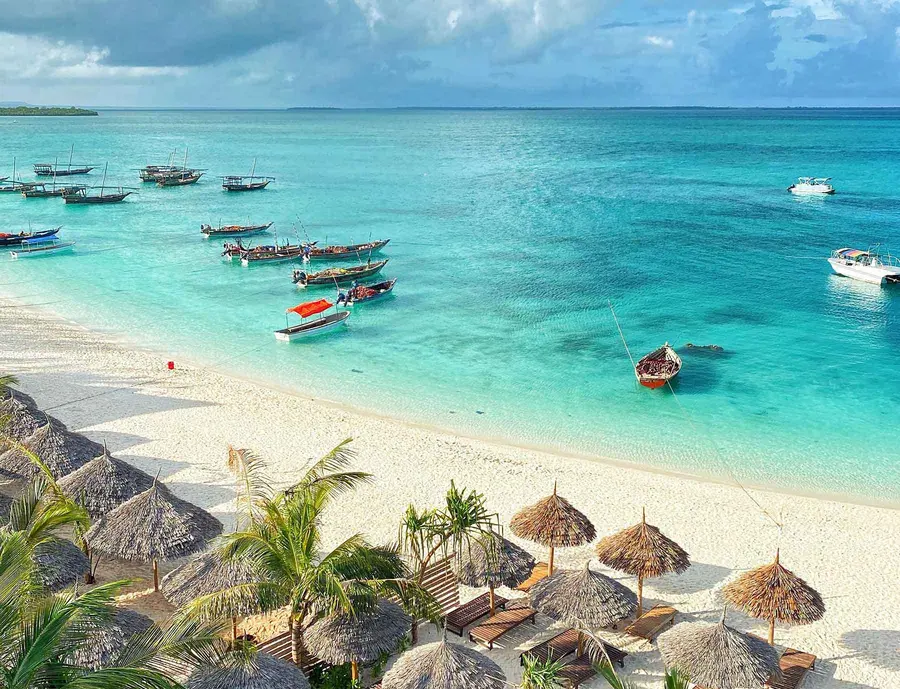 Wooden boats on a white-sand Zanzibar beach