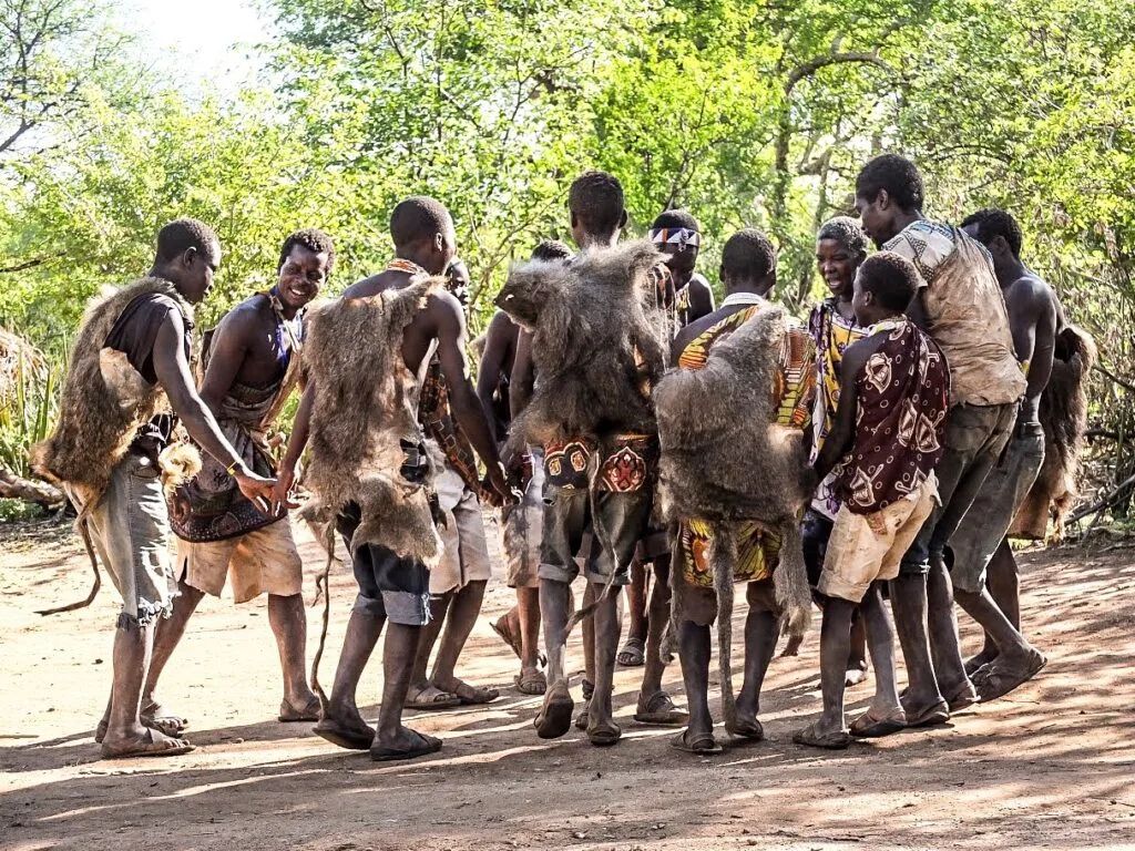 Hadzabe men gathered in a circle for a traditional dance