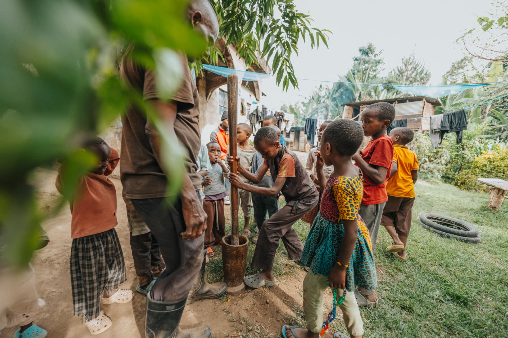A coffee grinding moment shared with children in a local garden